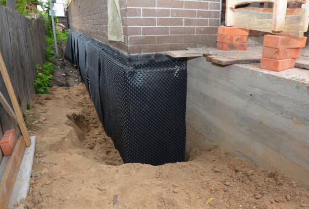 Happy homeowners after waterproofing job in Monrovia